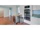 Well-appointed kitchen area with stainless steel ovens and a rolling island, perfect for food preparation at 5669 Sands Rd, Hollywood, SC 29449