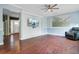 Cozy living room with wood-look flooring, decorative trim, and ample natural light at 5669 Sands Rd, Hollywood, SC 29449