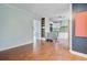 Spacious living room with hardwood floors, connected to the kitchen with stainless appliances at 5669 Sands Rd, Hollywood, SC 29449