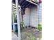Backyard featuring damaged wood siding and overgrowth at 6 Moultrie St, Charleston, SC 29403