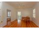 Bright room with wood floors featuring a desk, chair, and natural lighting at 622 Venning St, McClellanville, SC 29458