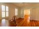 Bright bedroom featuring plantation shutters, hardwood floors, and natural lighting at 622 Venning St, McClellanville, SC 29458