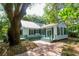 Charming home with brick pathway, mature trees, and a welcoming exterior at 622 Venning St, McClellanville, SC 29458