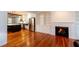 Open kitchen flows to living space, featuring stainless steel appliances and hardwood floors at 622 Venning St, McClellanville, SC 29458
