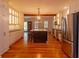 Spacious kitchen with an island, stainless steel appliances, and hardwood floors at 622 Venning St, McClellanville, SC 29458