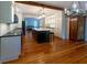 Spacious kitchen features hardwood floors, pendant lighting, and a dark kitchen island at 622 Venning St, McClellanville, SC 29458