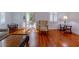 Bright living room featuring hardwood floors, built-in shelving, and natural light at 622 Venning St, McClellanville, SC 29458