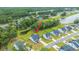 A beautiful home with well-maintained landscaping on a large lot overlooking a peaceful pond at 7070 Pumpkinseed Dr, Johns Island, SC 29455