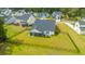 Aerial view of a well-maintained backyard with a screened porch and black fence at 7070 Pumpkinseed Dr, Johns Island, SC 29455
