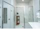Bathroom featuring glass shower enclosure with a glass door and a storage shelf at 7070 Pumpkinseed Dr, Johns Island, SC 29455