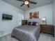 Comfortable bedroom featuring neutral walls, a ceiling fan, and a window with privacy shutters at 7070 Pumpkinseed Dr, Johns Island, SC 29455