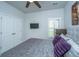 Comfortable bedroom featuring neutral walls, a ceiling fan, and a window with privacy shutters at 7070 Pumpkinseed Dr, Johns Island, SC 29455