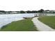 Community pier on the lake, featuring a walking path and docks for lake access at 7070 Pumpkinseed Dr, Johns Island, SC 29455