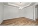 Bright dining area features wood flooring and decorative lighting fixture at 7070 Pumpkinseed Dr, Johns Island, SC 29455