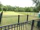 Fenced dog park with lush green grass and trees for shade, a community amenity at 7070 Pumpkinseed Dr, Johns Island, SC 29455
