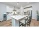 Modern kitchen featuring white cabinets, stainless steel appliances, a gas cooktop, and a large island at 7070 Pumpkinseed Dr, Johns Island, SC 29455
