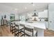 Bright, modern kitchen with white cabinets, quartz countertops, and stainless steel appliances at 7070 Pumpkinseed Dr, Johns Island, SC 29455