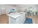 Open-concept kitchen with a large island, stainless steel appliances, and a view into the living room at 7070 Pumpkinseed Dr, Johns Island, SC 29455