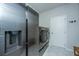 Laundry room with stainless steel appliances, tiled floors, a modern washer and dryer, and a utility sink at 7070 Pumpkinseed Dr, Johns Island, SC 29455