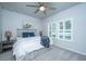 Bedroom features soft, neutral décor with a ceiling fan and plantation shutters at 7070 Pumpkinseed Dr, Johns Island, SC 29455