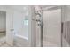 Modern bathroom showcasing a separate shower and bathtub with white tile surround and fixtures at 7401 Purser Ln, Hanahan, SC 29410