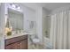 Functional bathroom with a vanity, toilet, and bathtub with a shower curtain at 7401 Purser Ln, Hanahan, SC 29410