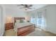 Comfortable bedroom with a wooden bed frame, bedside tables, and bright natural light at 7401 Purser Ln, Hanahan, SC 29410
