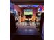 Finished garage with ceiling fan, wall-mounted TV, high-top table with barstools, safe, tool storage and neon beer signs at 7401 Purser Ln, Hanahan, SC 29410