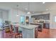Modern kitchen with granite countertops, stainless steel appliances, and dark cabinetry with an island at 7401 Purser Ln, Hanahan, SC 29410