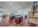 Spacious kitchen offers stainless steel appliances, granite counters, wood floors, and opens to living area at 7401 Purser Ln, Hanahan, SC 29410