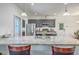 Modern kitchen with granite countertops, stainless steel appliances, and dark cabinetry and breakfast bar seating at 7401 Purser Ln, Hanahan, SC 29410