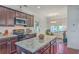 Updated kitchen featuring granite counters, stainless appliances and large island for food preparation and serving at 7401 Purser Ln, Hanahan, SC 29410