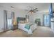 Serene bedroom with modern decor, a ceiling fan, and ample natural light from multiple windows at 7401 Purser Ln, Hanahan, SC 29410