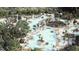 Resort-style pool area with palm trees, lounge chairs, and several covered pavilions, perfect for relaxation and recreation at 778 Clay Field Trl, Summerville, SC 29485