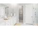 Elegant bathroom featuring dual sinks, quartz counters, and a glass-enclosed shower at 778 Clay Field Trl, Summerville, SC 29485