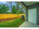 Well-kept backyard with grassy area, a new fence, and easy access to the back door and patio at 902 Twin Rivers Drive, Wando, SC 29492