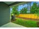 Cozy backyard with green lawn, tidy landscaping, and privacy fence; perfect for relaxing or entertaining at 902 Twin Rivers Drive, Wando, SC 29492