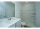 Bright bathroom features a walk-in shower and vanity with sink and mirror at 902 Twin Rivers Drive, Wando, SC 29492