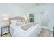 Bright bedroom with stylish decor, plush bedding, and natural light from window for a relaxing atmosphere at 902 Twin Rivers Drive, Wando, SC 29492