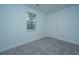 This bedroom features a window, neutral carpet and white walls at 902 Twin Rivers Drive, Wando, SC 29492