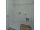 This laundry room features a wire rack for storage and a door at 902 Twin Rivers Drive, Wando, SC 29492