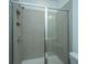 Tiled shower stall with glass doors features recessed storage and chrome fixtures at 902 Twin Rivers Drive, Wando, SC 29492