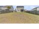 View of large backyard with lawn, privacy fence, a back porch, and AC Unit at 9706 Fanning Basket Ln, Ladson, SC 29456