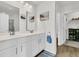This bathroom features double sinks, white cabinets, and ample space at 9706 Fanning Basket Ln, Ladson, SC 29456