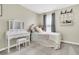 Bedroom featuring a bed, vanity, and window; well-lit and cozy at 9706 Fanning Basket Ln, Ladson, SC 29456