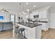 Open living area featuring kitchen island with granite, stainless appliances and a comfortable living space with a cozy couch at 9706 Fanning Basket Ln, Ladson, SC 29456