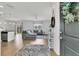 Open-concept living space boasting hardwood floors and a stylish sectional sofa at 9706 Fanning Basket Ln, Ladson, SC 29456