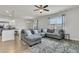 Bright living area showcasing hardwood floors and a comfortable sectional sofa at 9706 Fanning Basket Ln, Ladson, SC 29456