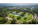 Beautiful aerial view of the neighborhood park featuring walkways, mature trees, and a small water feature at 1 Marlow Dr, Charleston, SC 29403