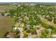 Aerial view of the neighborhood showcasing mature trees, community tennis courts, and residential landscape at 1 Marlow Dr, Charleston, SC 29403